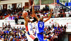 Action between Mighty sports Philippines (white) vs American university Dubai (blue) during 30th Dubai International basketball tournament at Shabab Al Ahli club in Dubai. February 1, 2019. Photo by Patrick Castillo