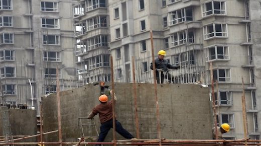 Chinese workers go about their chores at a new construction project in Shenyang, northeast China's Liaoning province on March 30, 2008. Premier Wen Jiabao recently said that preventing an overheated economy and reining in inflation were the two top priorities for 2008, but investment in real estate -- a key area of concern because of the speculative nature of the market -- still saw brisk growth in the first two months of 2008, rising 32.9 percent from the same period in 2007, inspite of a series of measures adopted by the government to cool down the property market, including policies to make it more expensive to buy a second home. CHINA OUT GETTY OUT AFP PHOTO