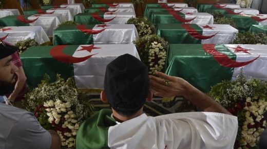 An Algerian man pays respect in front of the national flag-draped coffins containing the remains of 24 Algerian resistance fighters decapitated during the French colonial conquest of the North African country, presented at the capital's Palais De La Culture Moufdi Zakaria on July 4, 2020, a day after they were flown in from France. - Algeria yesterday received the skulls of the resistance fighters which had been stored for decades in a Paris museum.
France's 132 years of colonial rule, and the brutal eight-year war that ended it, have left a lasting legacy of often prickly relations between the two governments and peoples. (Photo by RYAD KRAMDI / AFP)