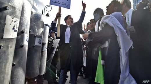 Algerian demonstrators, among them lawyers and journalists, take part in a protest against their ailing president's bid for a fifth term in power, in Algiers on March 7, 2019. - One thousand Algerian lawyers staged a demonstration today in front of the Constitutional Council against President Abdelaziz Bouteflika's re-election bid, saying his ill health should disqualify him from the race. The 82-year-old Bouteflika uses a wheelchair and has rarely been seen in public since suffering a stroke in 2013, and his bid to secure a fifth term at the April 18 election has sparked waves of protests. (Photo by RYAD KRAMDI / AFP)