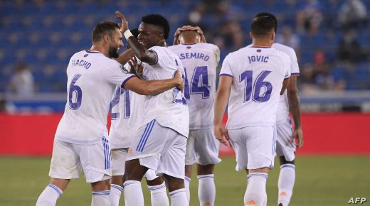 Real Madrid's Brazilian forward Vinicius Junior (2L) celebrates after scoring with Real Madrid's Spanish defender Nacho Fernandez (L) during the Spanish League football match between Alaves and Real Madrid at the Mendizorroza stadium in Vitoria on August 14, 2021. (Photo by Josep LAGO / AFP)