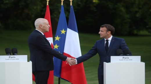 French President Emmanuel Macron (R) shakes ahnds with Tunisian President Kais Saied during a joint press conference after their meeting at the Elysee Palace, in Paris, on June 22, 2020. (Photo by Christophe PETIT TESSON / POOL / AFP)