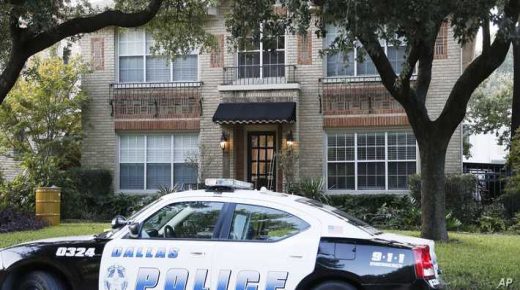 A police car is parked in front of the residence of a health care worker who tested positive for Ebola, Sunday, Oct. 12, 2014, in Dallas. The worker, who was caring for Ebola patient Thomas Eric Duncan, tested positive for the disease in preliminary tests. If the preliminary diagnosis is confirmed, it would be the first known case of the disease being contracted or transmitted in the U.S. (AP Photo/Brandon Wade)