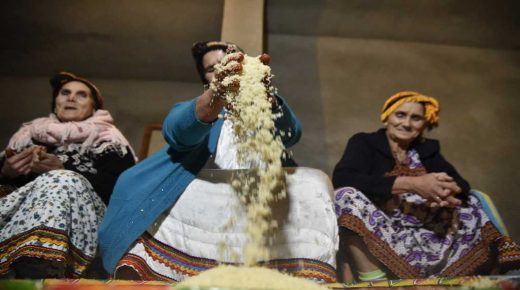 Algerian Berber women prepare couscous as they mark the Yennayer New Year in the village of Ait el-Kecem, south of Tizi-Ouzou, east of the capital Algiers, on January 11, 2018. - The Berbers -- an ethnic group descended from the pre-Arab populations across North Africa -- are currently celebrating their New Year festivities. Today -- for the first time -- the Yennayer New Year is being marked as a national holiday in Algeria. (Photo by RYAD KRAMDI / AFP)