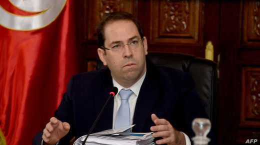 Tunisian Prime minister Youssef Chahed chairs a council of ministers meeting with his cabinet in Tunis on December 30, 2016. Chahed announced all jihadists returning from foreign battlefields would be immediately arrested and judged according to the country's counter-terrorism law. / AFP PHOTO / FETHI BELAID