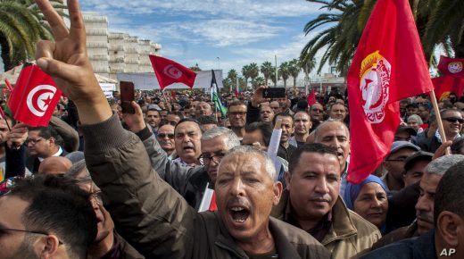 Hundreds of Tunisian public-sector workers demonstrate after failing to reach a wage agreement with the government, Thursday, Nov.22, 2018 in Tunis. The one-day strike was called by the powerful Tunisian General Labor Union.(AP Photo/Hassene Dridi)