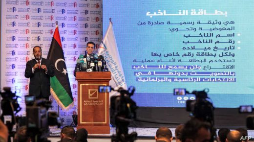 Imad al-Sayeh (R), the head of Libya's High National Electoral Commission, gives a press conference in the capital Tripoli on November 23, 2021. - Libya's electoral commission said that 98 candidates, including two women, have registered to run in a presidential election scheduled for December. Among the most notable hopefuls are Seif al-Islam Kadhafi, the son of slain dictator Moamer Kadhafi, and Khalifa Haftar, leader of the self-styled Libyan National Army in control of country's east and parts of the south. (Photo by Mahmud Turkia / AFP)