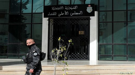 A police officer walks outside the Supreme Judicial Council building during a protest in Tunis, Tunisia February 6, 2022. REUTERS/Zoubeir Souissi
