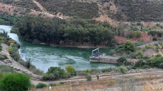 A picture taken on October 13, 2021 shows a view of the Medjerda river flowing through the Sidi Salem dam in the northern Tunisian area of Testour, in the Beja province. - The Sidi Salem reservoir supplies water to almost three million Tunisians, but years of drought across North Africa has left it critically low, an ominous sign for the region's future. All four Maghreb states -- Tunisia, Libya, Algeria and Morocco -- are among the 30 most water-stressed countries in the world, according to the World Resources Institute. And as droughts get longer and more intense in the coming years, farmers will be the first to feel the pinch. (Photo by Fethi Belaid / AFP)