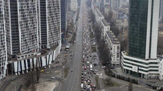 Traffic jams are seen as people leave the city of Kyiv, Ukraine, Thursday, Feb. 24, 2022. Russian President Vladimir Putin on Thursday announced a military operation in Ukraine and warned other countries that any attempt to interfere with the Russian action would lead to "consequences you have never seen." (AP Photo/Emilio Morenatti)