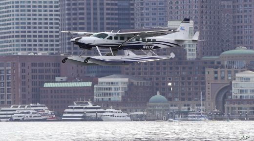 A Tailwind Air Cessna Grand Caravan EX Amphibian commuter seaplane lands on Boston Harbor after a flight from Manhattan, Tuesday, Aug. 3, 2021, in Boston. (AP Photo/Charles Krupa)