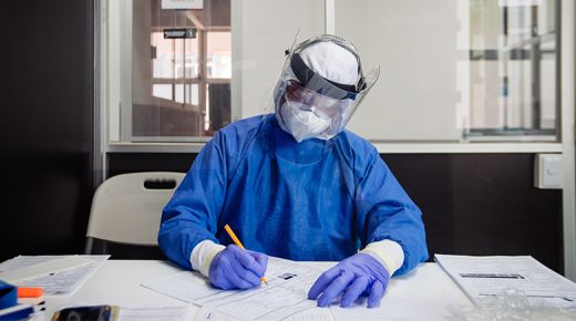 A Mexican chemistry doctor filling out paper work before an antibody Coronavirus Covid19 mouth and nose exam