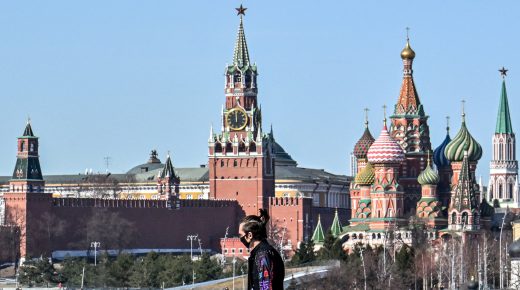 A pedestrian walks on a bridge near the Kremlin in central Moscow on March 22, 2022. (Photo by AFP)