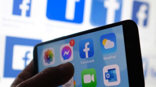 (FILES) This file photo illustration photo shows a Facebook App logo displayed on a smartphone in Los Angeles, March 1, 2021. - An Israeli firm accused of supplying spyware to governments has been linked to a list of tens of thousands of smartphone numbers, including those of activists, journalists, business executives and politicians around the world, according to reports.The NSO Group and its Pegasus malware -- capable of switching on a phone's camera or microphone, and harvesting its data -- have been in the headlines since 2016, when researchers accused it of helping spy on a dissident in the United Arab Emirates. The July 18, 2021 revelations -- part of a collaborative investigation by The Washington Post, The Guardian, Le Monde and other media outlets -- raise privacy concerns and reveal the far-reaching extent to which the private firm's software could be misused. (Photo by Chris DELMAS / AFP)