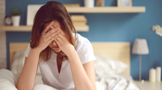 Unhappy girl in a bedroom