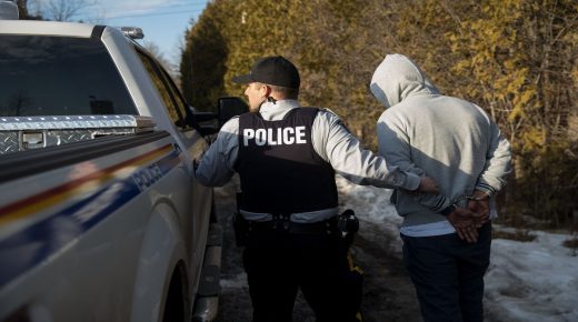 HEMMINGFORD, QUEBEC - FEBRUARY 22: A man claiming to be from Sudan is apprehended by Royal Canadian Mounted Police officers after he crossed the U.S.-Canada border into Canada, February 22, 2017 in Hemmingford, Quebec. In the past month, hundreds of people have crossed Quebec land border crossings in attempts to seek asylum and claim refugee status in Canada. (Photo by Drew Angerer/Getty Images)