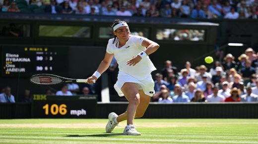 Tunisia's Ons Jabeur returns the ball to Kazakhstan's Elena Rybakina during their women's singles final tennis match on the thirteenth day of the 2022 Wimbledon Championships at The All England Tennis Club in Wimbledon, southwest London, on July 9, 2022. (Photo by SEBASTIEN BOZON / AFP) / RESTRICTED TO EDITORIAL USE