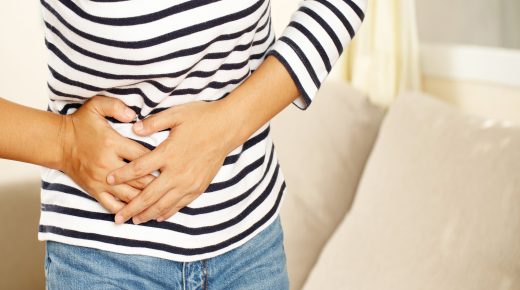 Woman having a stomachache, or menstruation pain. suffering from abdominal. Menstrual cramps. Healthcare and medical, gynecology concept.