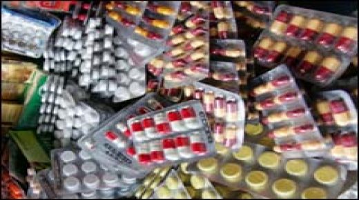 Smuggled and/or counterfeit medicine is sold 14 June 2007 on the Adjame market in Abidjan. Ivorian pharmacists are worried about the multiplication of fraudulent street medecine that are, according to them, threatening their trade and the health of patients. Fraudulent street medecine sales have risen by 15 to 25 percent in the last two years in Ivory Coast and represent a 53 million euro a year loss for the legal pharmaceutical sector, according to the chairman of the national order council, overseeing the trade, Parfait Kouassi.
AFP PHOTO / ISSOUF SANOGO
