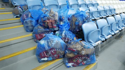 AL WAKRAH, QATAR - DECEMBER 05: Japan fans clear rubbish in the stands after the FIFA World Cup Qatar 2022 Round of 16 match between Japan and Croatia at Al Janoub Stadium on December 05, 2022 in Al Wakrah, Qatar. (Photo by Maja Hitij - FIFA/FIFA via Getty Images)