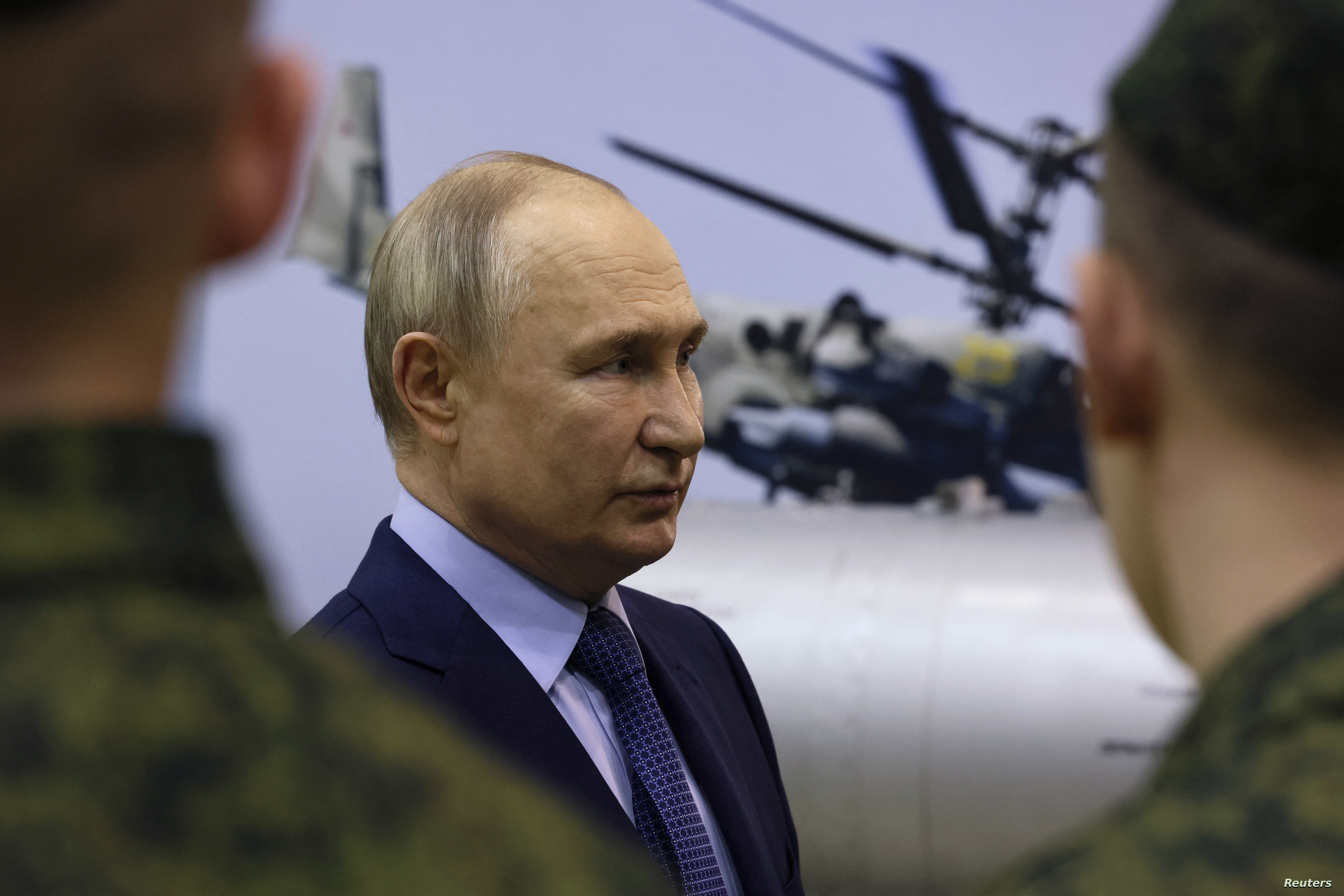 Russian President Vladimir Putin talks to military pilots at the 344th State Centre for combat use and retraining of flight crews of the Russian Defence Ministry in the town of Torzhok in the Tver Region, Russia March 27, 2024. Sputnik/Mikhail Metzel/Pool via REUTERS ATTENTION EDITORS - THIS IMAGE WAS PROVIDED BY A THIRD PARTY.