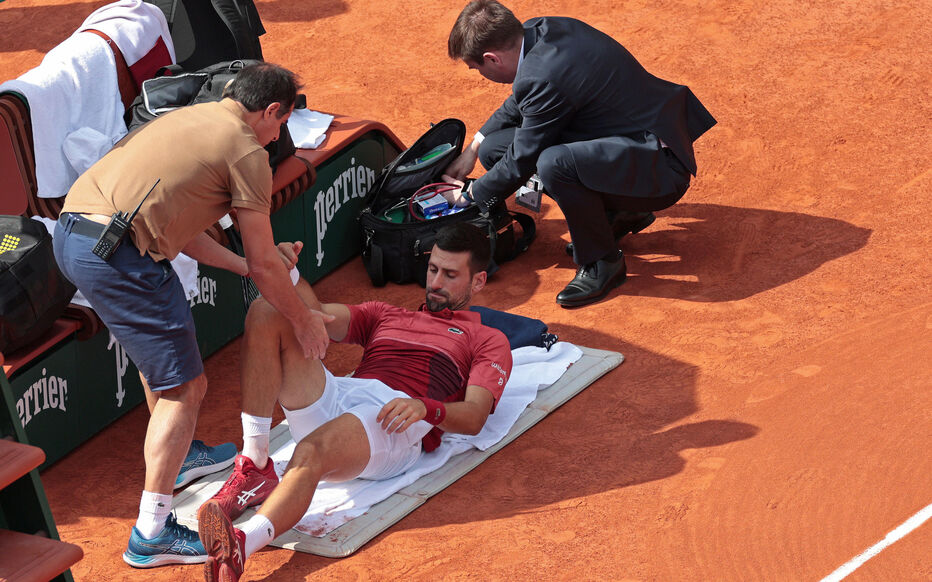 3rd June 2024; Roland Garros, Paris, France; 2024 French Open Tennis tournament, Day 9; Novak Djokovic receives treatment for his knee during his match versus Francisco Cerundolo (arg)