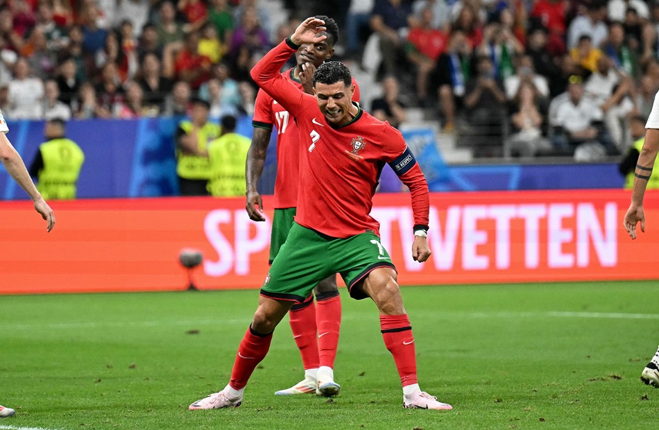 Portugal's forward #07 Cristiano Ronaldo reacts during the UEFA Euro 2024 round of 16 football match between Portugal and Slovenia at the Frankfurt Arena in Frankfurt am Main on July 1, 2024. (Photo by PATRICIA DE MELO MOREIRA / AFP)