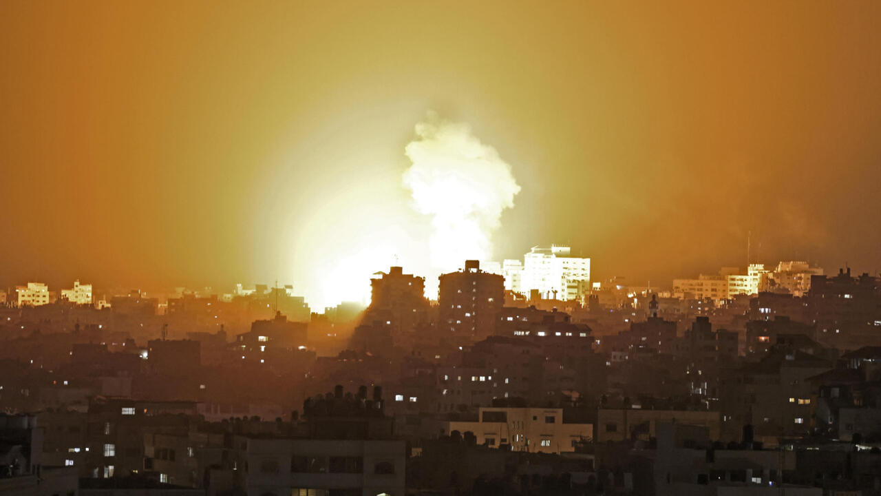 Fire billows from an Israeli air strike in the Gaza Strip, controlled by the Palestinian Islamist movement Hamas, on May 10, 2021. - Israel launched deadly air strikes on Gaza Monday in response to a barrage of rockets fired by the Islamist movement Hamas amid spiralling violence sparked by unrest at Jerusalem's Al-Aqsa Mosque compound. (Photo by MAHMUD HAMS / AFP)