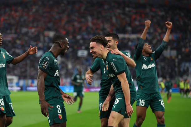 Neil EL AYNAOUI of Lens, Anass ZAROURY of Lens and Deiver MACHADO of Lens celebrate after scores during the Ligue 1 McDonald's match between Marseille and Lens at Orange Velodrome on March 8, 2025 in Marseille, France. (Photo by Johnny Fidelin/Icon Sport via Getty Images)