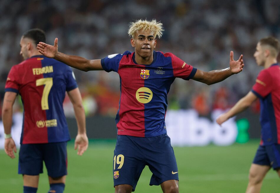Barcelona's Spanish forward #19 Lamine Yamal celebrates after Barcelona's Spanish forward #07 Ferran Torres scored their team's second goal during their Spanish Cup, Copa del Rey (King's Cup) final football match between FC Barcelona and Real Madrid CF at La Cartuja stadium in Seville on April 26, 2025. (Photo by Pierre-Philippe MARCOU / AFP)