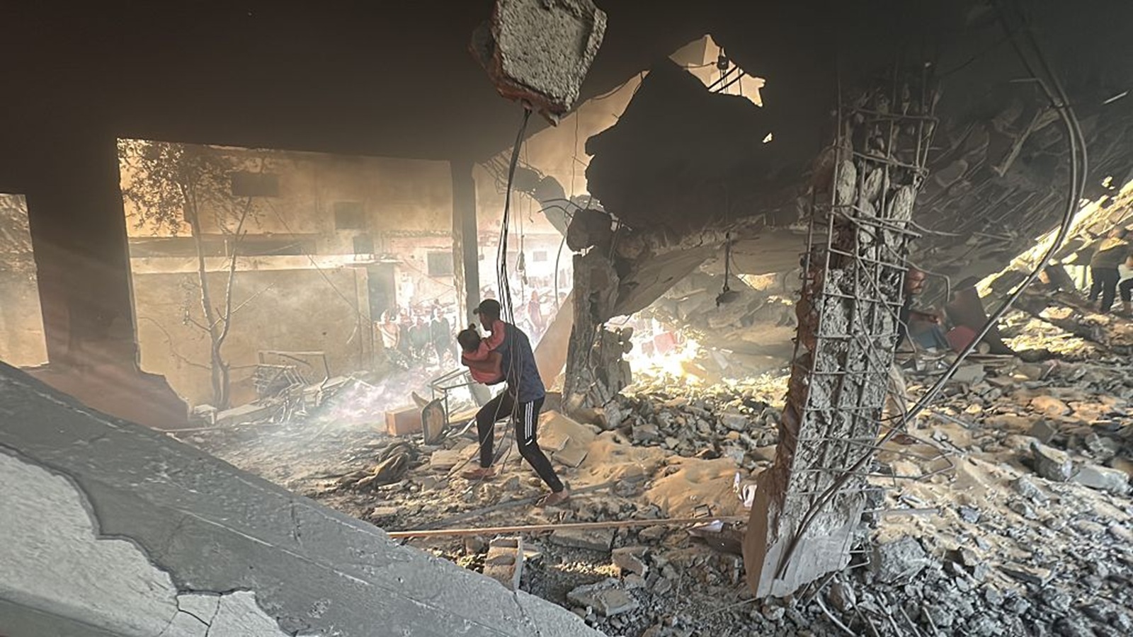 GAZA - APRIL 03: Palestinians conduct search and rescue works following an Israeli airstrike on the Dar al-Arkam School in eastern Gaza, which was sheltering displaced civilians on April 3, 2025. The attack killed 19 Palestinians, including children, and caused widespread destruction in the area. (Photo by Khames Alrefi/Anadolu via Getty Images)